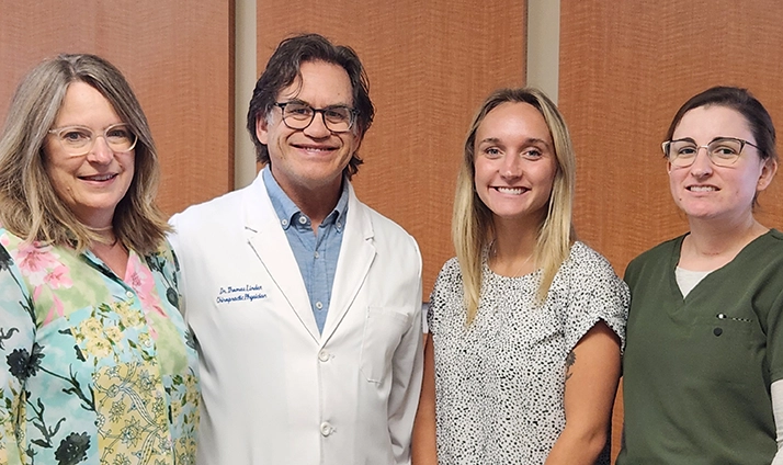 Thomas Linden smiling with his team.